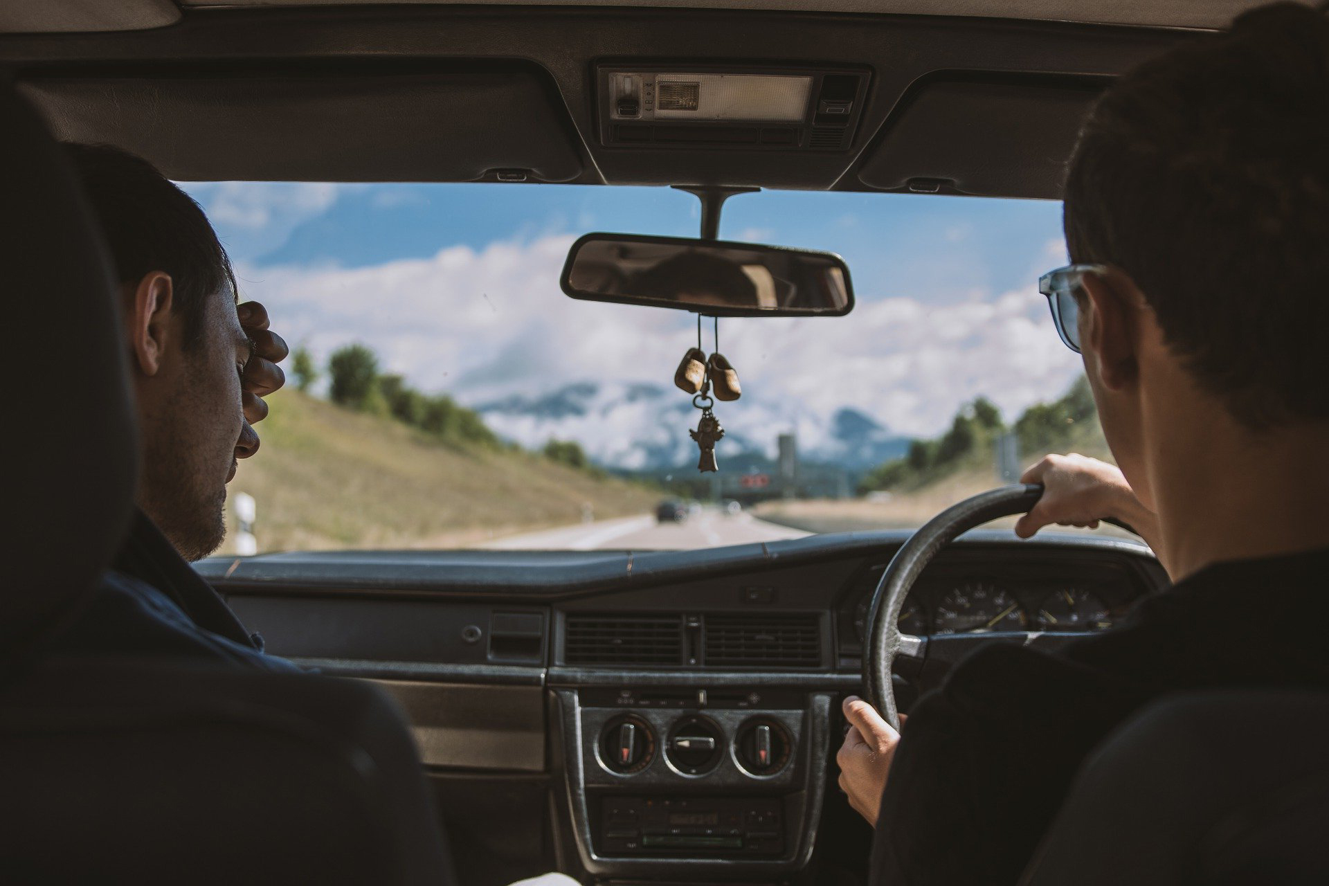 Two people talking whilst driving
